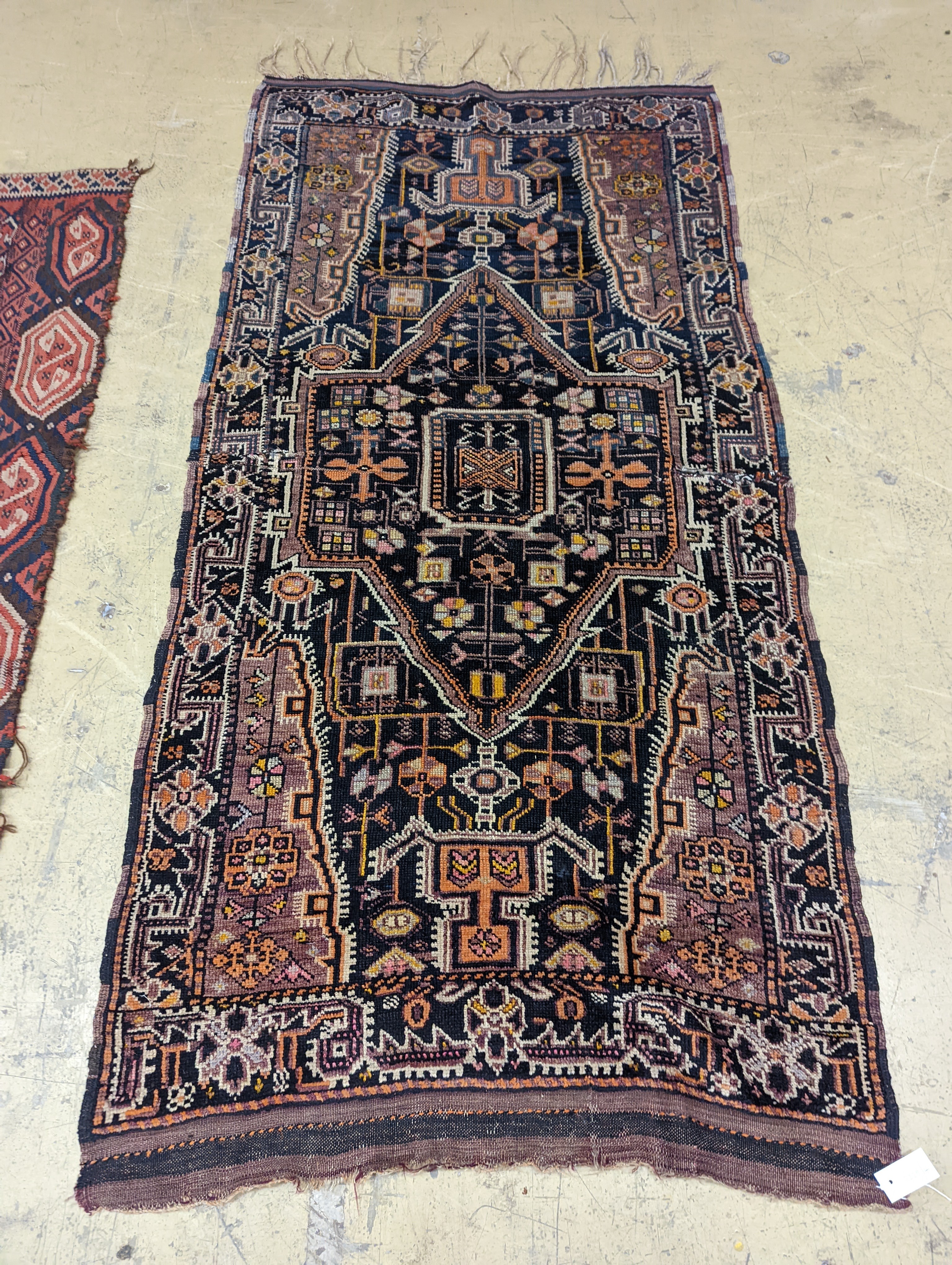 A Caucasian design blue ground rug, 224 x 111cm